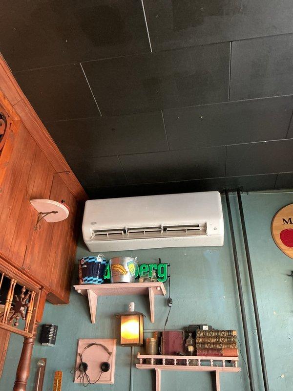 Responded to service call for condensation backup issue on 4-year-old commercial mini split system. Inspected wall-mounted indoor evaporator unit and outdoor condenser unit, cleared condensate drain line blockage, verified proper drainage flow, and tested system operation to ensure resolution of water backup condition.