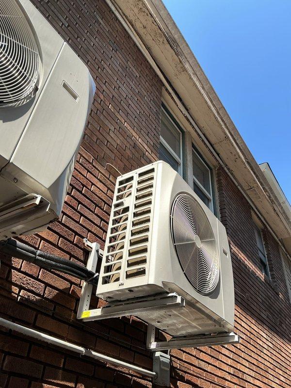 Responded to service call for condensation backup issue on 4-year-old commercial mini split system. Inspected wall-mounted indoor evaporator unit and outdoor condenser unit, cleared condensate drain line blockage, verified proper drainage flow, and tested system operation to ensure resolution of water backup condition.