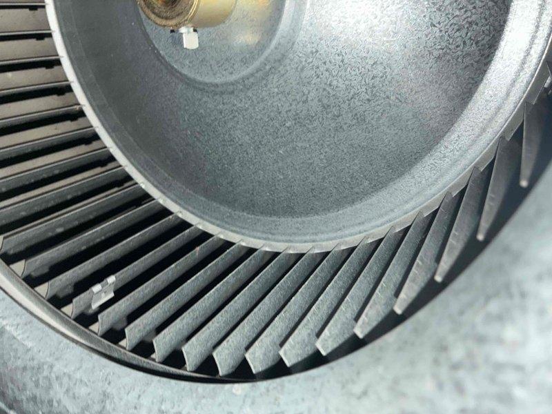Completed routine HVAC cooling maintenance on residential furnace system, including inspection of blower assembly and verification of proper operation. Accessed unit through side entrance as requested, inspected blower wheel showing normal dust accumulation, and shut down AC system upon completion per customer instructions.
