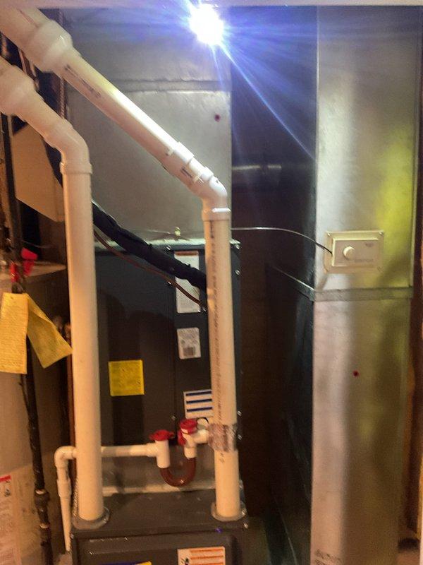 Completed comprehensive preventive maintenance on residential cooling system. Inspected indoor air handler unit in basement mechanical room, verifying proper operation of all components, drainage systems, and electrical connections. Performed outdoor condenser unit inspection, checking refrigerant lines, condensate drainage, electrical connections, and overall equipment condition. All systems operating within normal parameters with no deficiencies noted.