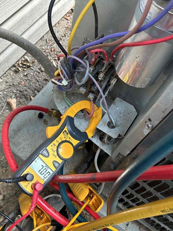 Returned to complete HVAC system repair by adding leak sealant to the refrigerant circuit and recharging the unit to manufacturer specifications. Performed electrical diagnostics using clamp meter to verify proper amperage draw and confirm system operation after refrigerant charge was restored.