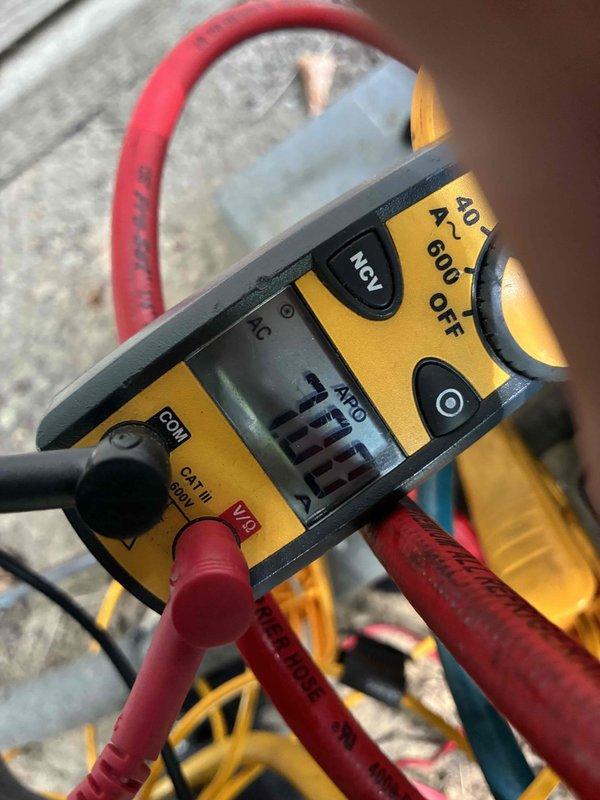 Returned to complete HVAC system repair by adding leak sealant to the refrigerant circuit and recharging the unit to manufacturer specifications. Performed electrical diagnostics using clamp meter to verify proper amperage draw and confirm system operation after refrigerant charge was restored.