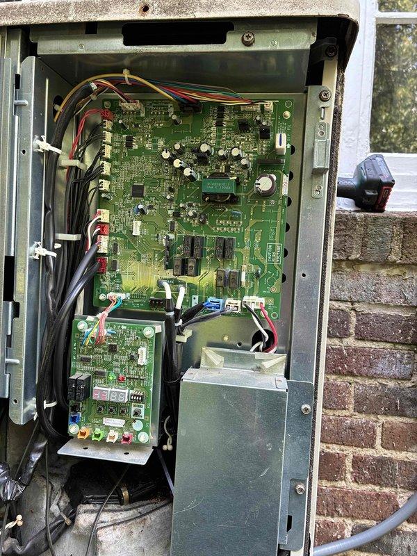 # HVAC Cooling Maintenance Summary

Completed routine preventive maintenance on residential cooling system as part of ongoing service plan. Performed comprehensive inspection of air handling unit, verifying proper airflow and examining air filter condition. Filter displayed "LIVE FREE. BREATHE FREELY." branding and showed normal service wear. Inspected flexible metallic ductwork for integrity and proper connection. Accessed outdoor condensing unit control panel mounted on exterior brick wall. Examined electrical components including dual green circuit boards, control wiring, transformer assembly, and all electrical connections. Verified proper wire terminations on red, white, green, yellow, and black conductors. All system components operating within normal parameters with no deficiencies noted.