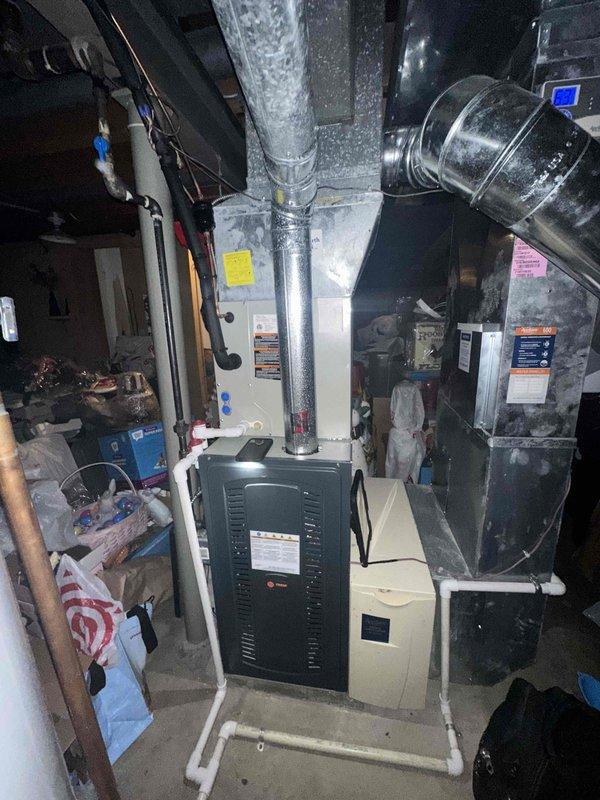 Completed scheduled cooling system maintenance on residential HVAC unit located in basement utility area. Performed comprehensive inspection of furnace, air handler, and associated ductwork components, verifying proper operation of all cooling system elements. All equipment found to be functioning within normal parameters with no immediate service needs identified.