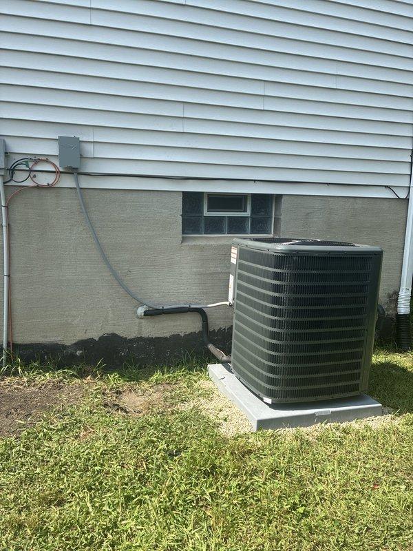 Completed installation of new air conditioning system including outdoor condensing unit positioned on concrete pad with proper clearances. Installed refrigerant line set, electrical disconnect, and conduit from exterior disconnect box to unit. Routed ductwork through basement area connecting to existing infrastructure, secured all runs to ceiling joists with appropriate hangers and supports. Verified electrical connections, tested system operation, and collected full payment upon successful completion.