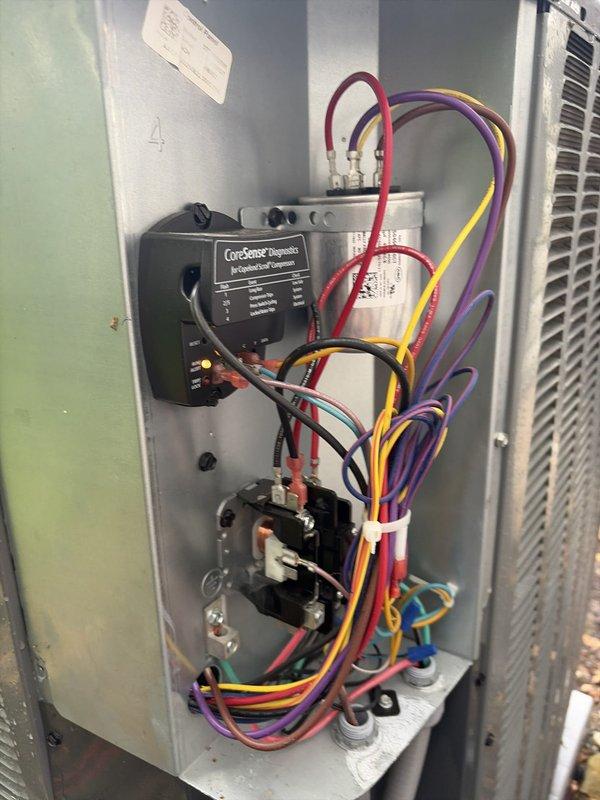 Completed routine cooling system maintenance visit on residential HVAC unit. Performed comprehensive inspection of electrical control panel, verifying proper operation of capacitor, contactor, and all associated wiring connections. Utilized CoreSense diagnostic equipment to assess system performance and electrical parameters. Measured supply air temperature at floor register, confirming 52.1°F output, which indicates proper cooling operation and adequate refrigerant charge. All components found in good working condition with no repairs required.