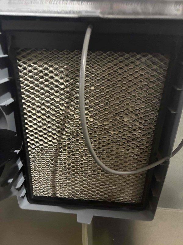 Performed comprehensive maintenance on cooling system serving eight zones. Conducted thorough inspection of evaporator coil assembly, noting mesh filter condition with minor dust accumulation and discoloration patterns consistent with normal operation. Verified electrical parameters using calibrated digital multimeter, confirming voltage reading of 232.2V within acceptable range for system specifications. Inspected condensate drainage line for proper function and motor assembly for signs of wear or abnormal operation. All components operating within manufacturer specifications upon completion of preventive maintenance service.