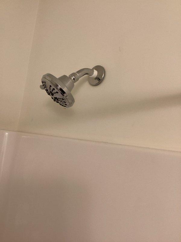 Responded to complaint of loud noise occurring during shower operation. Inspected shower head, supply arm, and mixing valve assembly for loose connections, mineral buildup, or worn components. Verified proper water pressure and flow through the system. Addressed the noise issue to restore normal, quiet operation of the shower fixture.