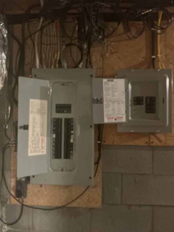 Conducted on-site electrical assessment to provide estimate for ceiling fan and outlet installations. Inspected existing electrical infrastructure including main distribution panel with dual breaker boxes to verify adequate circuit capacity and determine optimal branch circuit routing for new fixtures. Evaluated interior room requiring additional outlets and ceiling fan installation, noting current electrical outlet placement and accessibility for new wiring runs. Documented panel configuration and room layout to develop accurate material list and labor requirements for proposed electrical upgrades.
