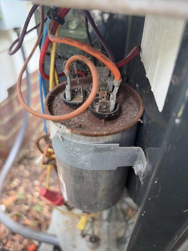 Completed routine cooling maintenance on residential HVAC system. Inspected and tested electrical components including capacitor, which showed significant corrosion and rust on terminals but maintained proper electrical function. Measured supply air temperature at 58°F through main ductwork. Verified system operation and confirmed adequate cooling performance throughout inspection.
