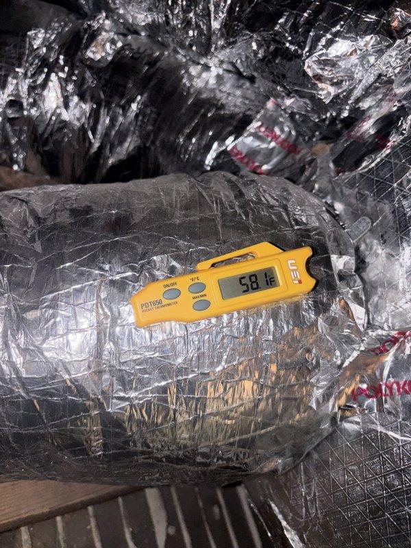 Completed routine cooling maintenance on residential HVAC system. Inspected and tested electrical components including capacitor, which showed significant corrosion and rust on terminals but maintained proper electrical function. Measured supply air temperature at 58°F through main ductwork. Verified system operation and confirmed adequate cooling performance throughout inspection.