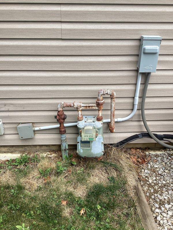 Completed on-site electrical estimate for installation of customer-supplied Generac generator. Assessed interior electrical panel location in basement utility area with exposed beam ceiling construction and existing electrical infrastructure. Evaluated exterior installation requirements including proximity to existing gas meter with corroded copper supply lines and electrical disconnect panel mounted on vinyl siding. Documented current utility connections, available installation space, and necessary electrical service upgrades required for generator integration. Provided comprehensive quote for complete generator installation including transfer switch, electrical connections, and code-compliant setup.
