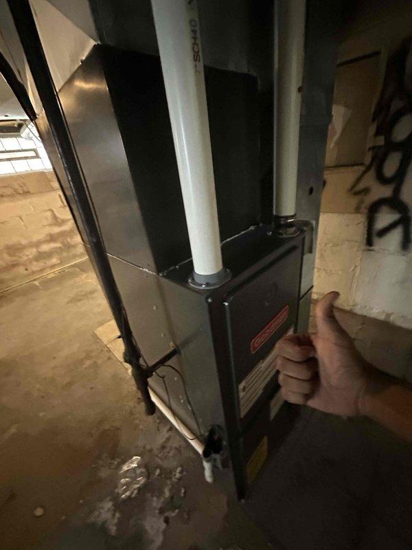 Completed scheduled preventive cooling maintenance on residential HVAC system. Inspected air handler unit, verified operational status of all components, and documented equipment condition with photographic records. Observed substantial dust and cobweb accumulation on electrical terminal connections within control panel, indicating extended service interval; noted minor moisture presence at equipment base requiring monitoring for potential condensate drain concerns.