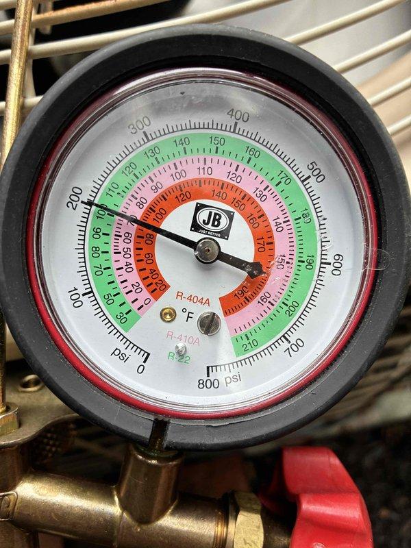 Completed non-member cooling system tune-up on residential HVAC unit. Performed standard maintenance inspection including refrigerant pressure checks using manifold gauges, which showed R-410A system operating within normal parameters. Inspected blower assembly and electrical connections in air handler, noting dust accumulation on motor housing and surrounding components. Provided quote for indoor evaporator coil cleaning service as requested.