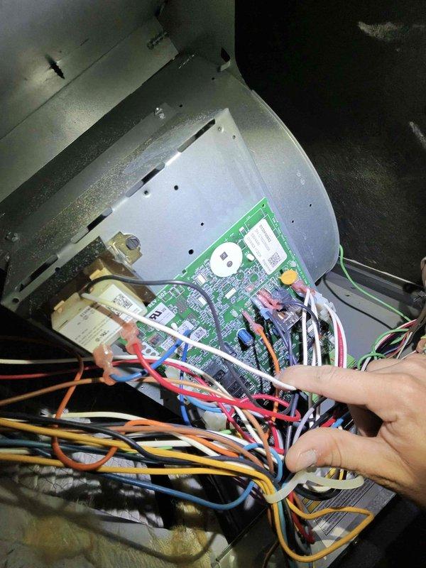 Responded to no cooling complaint on residential air conditioning system. Performed diagnostic testing using digital instruments to measure system parameters at the air handler unit. Inspected control board and wiring connections, examining the low-voltage thermostat wiring bundle and verifying proper connections to the integrated control module. All electrical components and circuit board were assessed for proper operation.