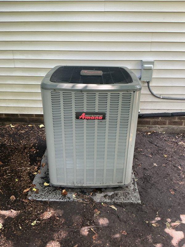 Replaced failed condenser fan motor and dual run capacitor on Amana outdoor unit. Performed thorough condenser coil cleaning to restore proper airflow and heat transfer efficiency, removing accumulated debris and contaminants from coil fins and unit interior.