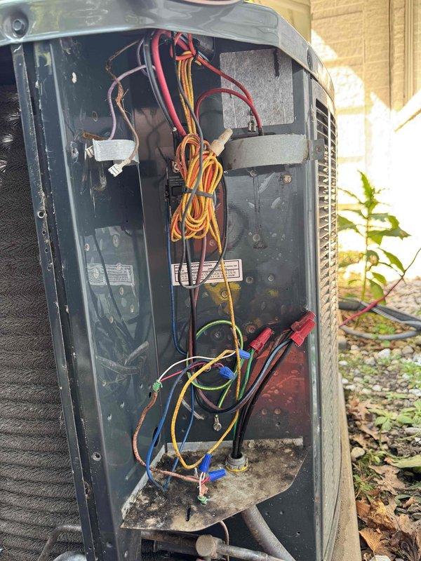 Responded to service call for outdoor condensing unit with slow motor rotation and insufficient compression. Upon inspection, diagnosed failed run capacitor causing reduced motor speed and compromised compressor operation. Removed defective capacitor, tested electrical readings with clamp meter to verify proper voltage and amperage, and installed new replacement capacitor. Verified proper motor operation and compressor function upon startup, restoring unit to normal operating condition.