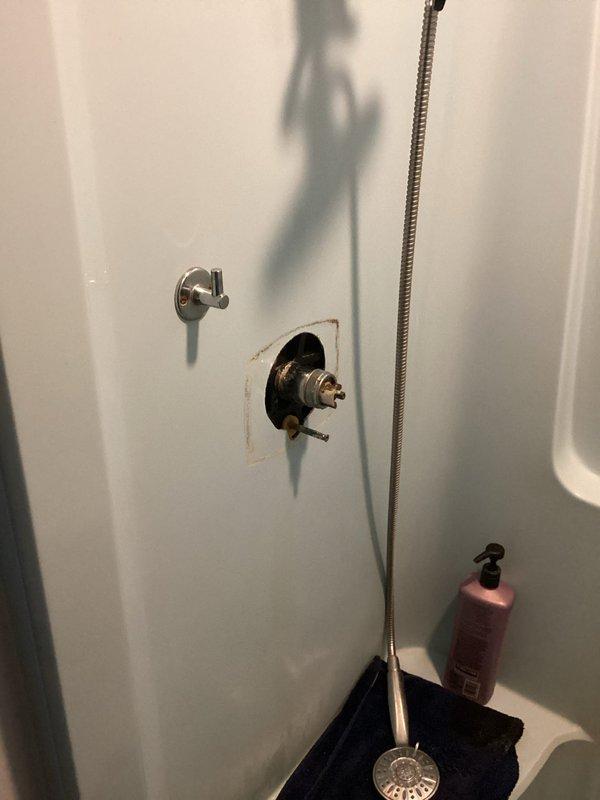 Completed comprehensive whole-home plumbing inspection during mid-morning visit. Assessed shower valve assembly with missing trim plate and noted corrosion staining on surrounding fixture area requiring attention. Evaluated toilet installation height and documented Delta shower head assembly for future estimate preparation.