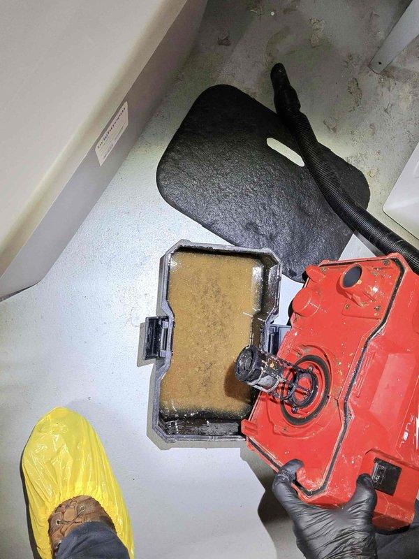 Responded to service call for reported refrigerant leak in residential air conditioning system. Upon arrival, performed comprehensive visual inspection of HVAC equipment located in basement mechanical room. Examined air handler unit, associated ductwork connections, and refrigerant lines for signs of leakage. Conducted leak detection procedures on copper tubing, coil components, and mechanical connections. Inspected air filter condition and found contamination requiring replacement. Removed dirty air filter from system and installed new filter media to restore proper airflow and system efficiency. Documented equipment condition through photographic records showing air handler installation, ductwork configuration, and filter replacement. System requires follow-up refrigerant leak repair to restore full cooling capacity.