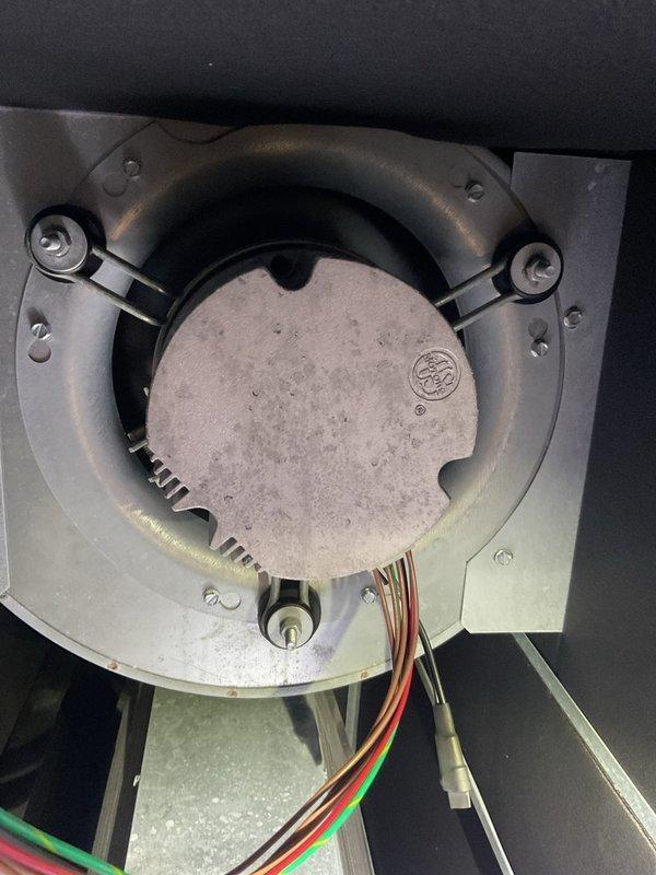 Performed comprehensive cooling system tune-up on residential air handler unit. Inspected blower motor assembly, noting dust accumulation on housing and cover plate; verified electrical connections and wire bundles for proper operation. Examined ductwork connections, condensate drain line, and overall system installation; provided customer with information regarding maintenance plan options and system performance optimization.