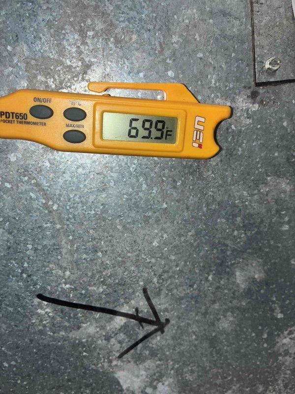 Completed installation of two air conditioning systems with two air scrubber units. Performed diagnostic testing and verification measurements using digital manometer to confirm proper pressure differentials and airflow, with readings indicating system operating within manufacturer specifications at 0.82 inWC. Temperature verification conducted showing ambient conditions at 69.9°F during commissioning phase.