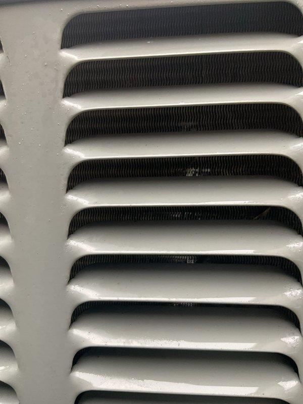 Completed routine HVAC cooling maintenance on residential Amana air conditioning condenser unit. Performed standard preventive maintenance inspection, verified proper operation of all components including fan assembly and louver airflow system, and confirmed unit functionality with no issues identified.