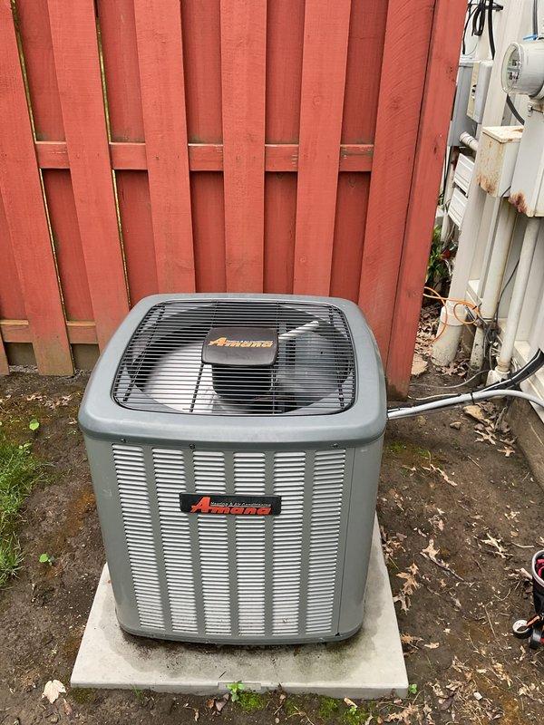Completed routine HVAC cooling maintenance on residential Amana air conditioning condenser unit. Performed standard preventive maintenance inspection, verified proper operation of all components including fan assembly and louver airflow system, and confirmed unit functionality with no issues identified.
