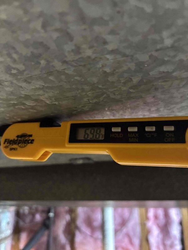 Completed scheduled preventive maintenance on residential cooling system. Inspected electrical connections at outdoor unit, verifying proper wire terminations and grounding integrity. Measured supply air temperature at ductwork, recording 69.8°F to confirm adequate cooling performance and system operation within normal parameters.
