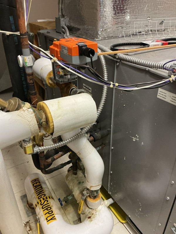 Responded to service call for non-functional cooling system on 11-year-old Carrier commercial air conditioning unit. Upon arrival, diagnosed failed control boards preventing system operation. Attempted system reset per manufacturer protocol, but issue persisted, confirming control board failure. Replaced defective Carrier control boards with OEM components and restored full system functionality. Verified proper operation of all cooling cycles, checked electrical connections, and confirmed system parameters were within normal operating specifications. Unit returned to service with all functions operating as designed.