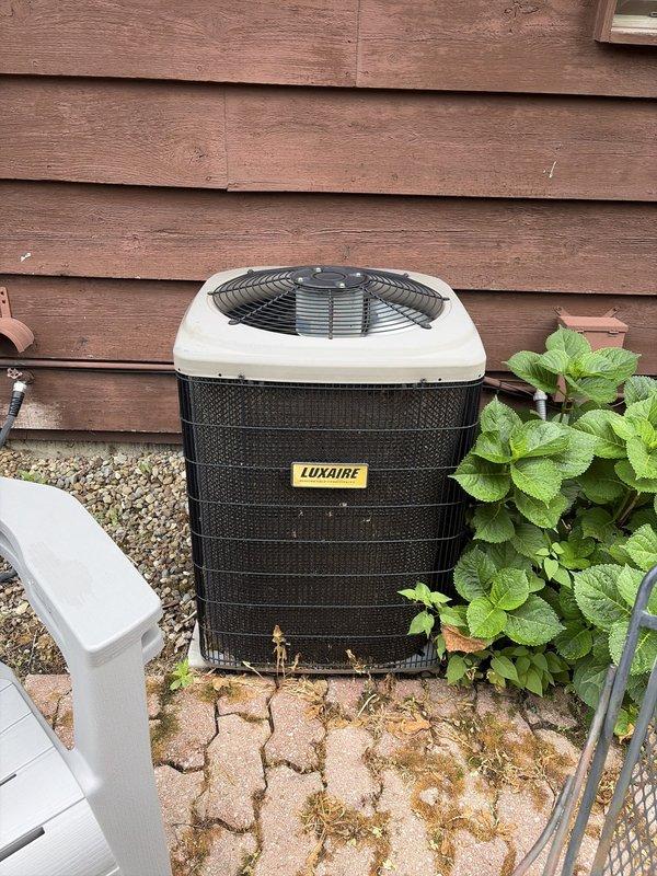 Completed comprehensive cooling system tune-up on residential HVAC unit. Inspected Luxaire outdoor condensing unit, verified proper operation of fan assembly and compressor, and checked refrigerant levels. Replaced indoor air filter with new Nexton brand filter and confirmed proper airflow throughout the system.
