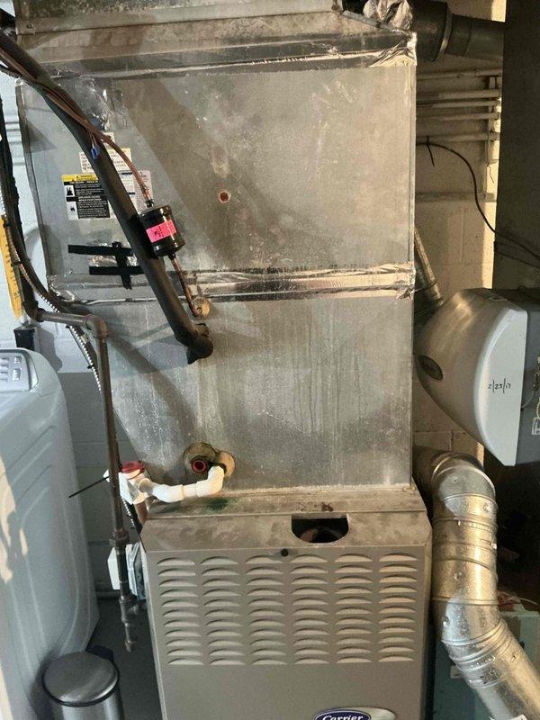 Completed comprehensive estimate for full HVAC system replacement of 20-year-old Carrier furnace and associated equipment. Evaluated existing system including furnace, ductwork, refrigerant lines, and auxiliary components such as humidifier, documenting current condition with photographic evidence showing normal wear, dust accumulation, and age-related deterioration. Presented customer with multiple replacement options including furnace configurations to address end-of-service-life equipment.