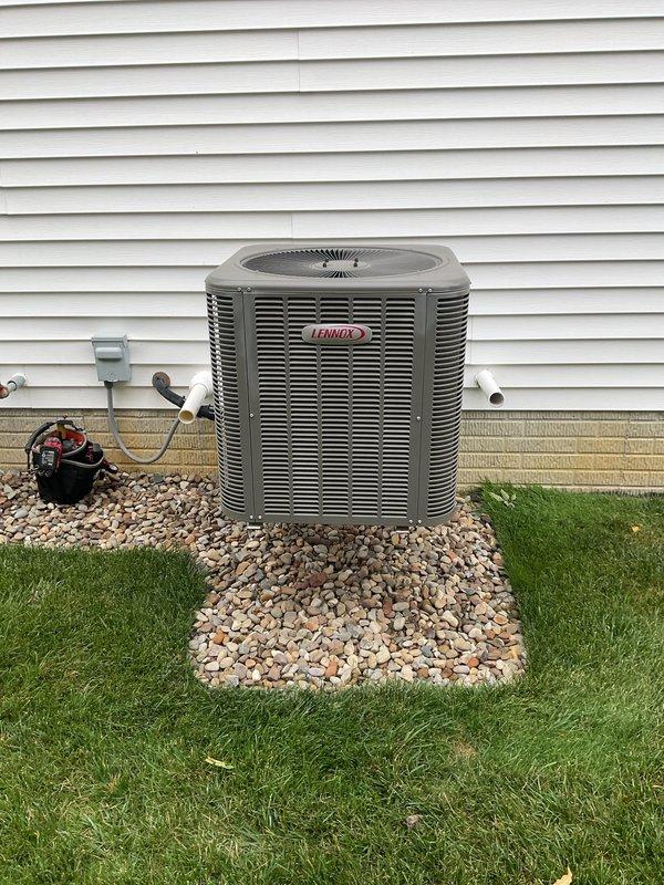 Completed seasonal cooling maintenance on Lennox air conditioning system and furnace unit. Performed comprehensive inspection of outdoor condensing unit, verified proper operation of compressor and condenser fan motor, checked refrigerant levels and electrical connections. Inspected indoor furnace cabinet and associated components including PVC vent piping, condensate drain system, and refrigerant line connections. All equipment found operating within normal parameters with no deficiencies noted.