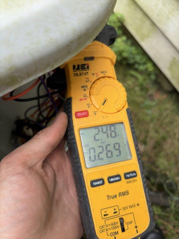 Performed HVAC tune-up service on residential air conditioning system. Inspected and replaced air filter with new FILTERBUY pleated filter at indoor air handler unit. Conducted electrical diagnostics at outdoor condenser unit using clamp meter, verifying voltage and amperage readings to ensure proper system operation and performance.