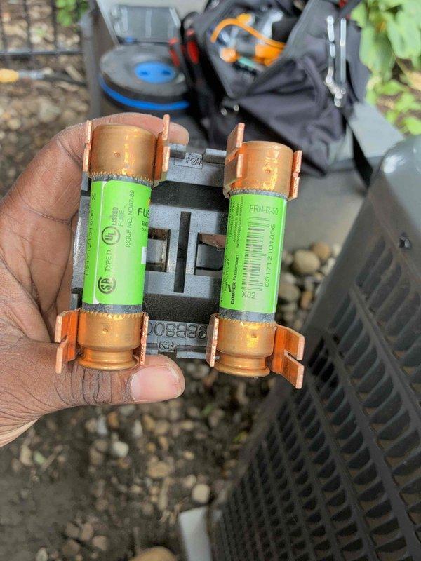 Performed seasonal cooling system tune-up on residential HVAC unit. Inspected and tested electrical components including dual fuse assembly, verified proper amperage readings using digital clamp meter, and confirmed all system functions operating within manufacturer specifications.