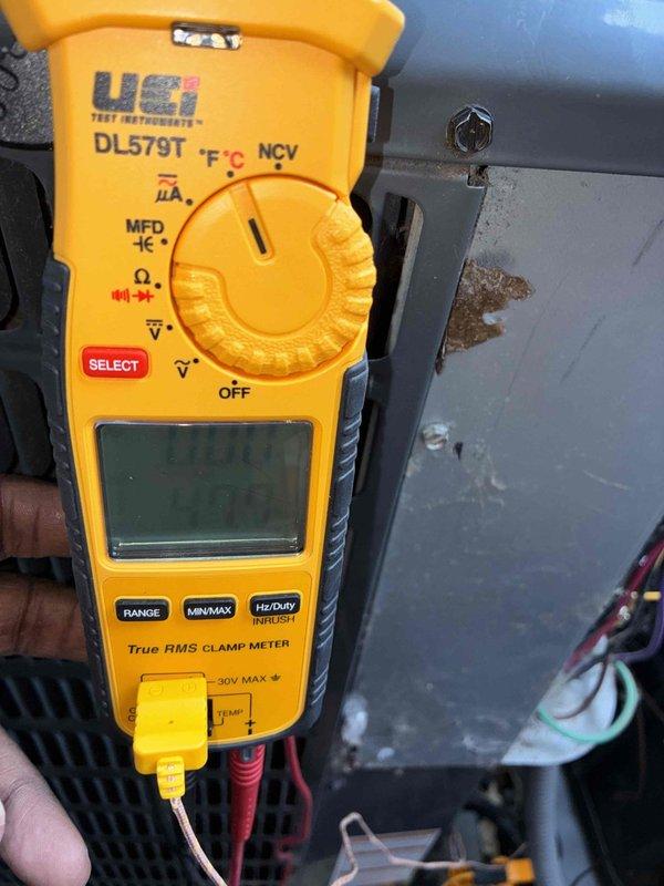 Performed seasonal cooling system tune-up on residential HVAC unit. Inspected and tested electrical components including dual fuse assembly, verified proper amperage readings using digital clamp meter, and confirmed all system functions operating within manufacturer specifications.