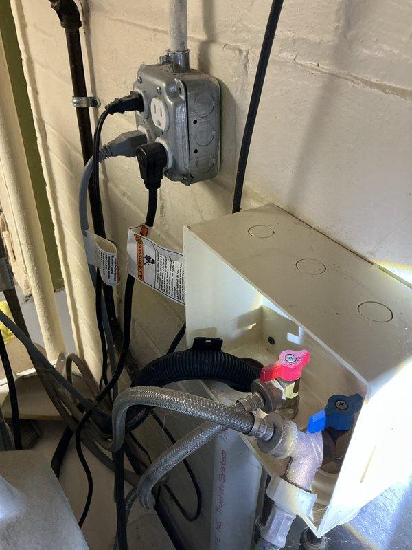 Completed courtesy plumbing inspection of utility area and kitchen sink installation. Inspected electrical junction box, water heater connections, supply lines, and shutoff valves in mechanical room—all components functioning properly with no leaks detected. Evaluated under-sink water treatment system including Evolution Pro water softener unit, filtration components, and associated plumbing connections; verified proper operation and identified no immediate service needs.