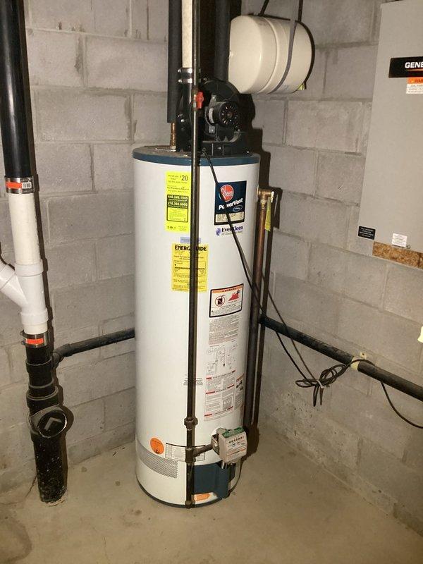 Responded to service call for tanked water heater producing high-pitched sound from exhaust system. Upon inspection, identified noise originating from exhaust vent piping and confirmed proper operation of water heater unit, pressure relief valve, and all plumbing connections. Completed diagnostic assessment and documented equipment condition with photographic evidence.