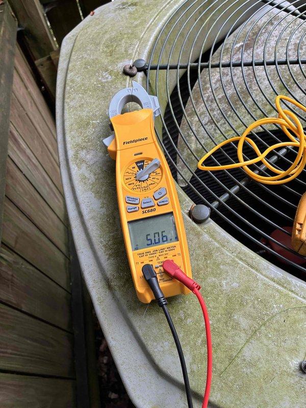Completed preventive maintenance on two residential cooling systems. Performed comprehensive inspection and diagnostics on outdoor condensing units, measuring electrical parameters and refrigerant temperatures. Unit exhibited weathering and organic growth on exterior surfaces, which is typical for outdoor equipment exposure. Recorded amp draw of 50.6 amps and superheat reading of -5.9°F during operational testing. Both systems evaluated for proper mechanical and electrical function as part of ongoing maintenance program.