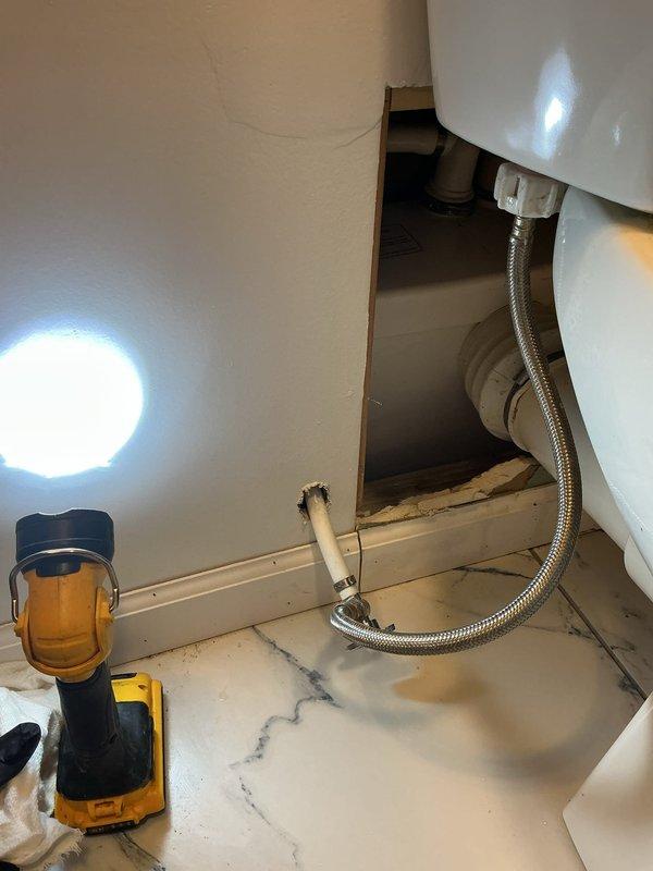 Responded to service call for non-functioning Saniflo Saniaccess 3 macerator pump system in basement bathroom. Upon arrival, confirmed motor was humming but macerator blade and pump were not engaging, resulting in wastewater backup into shower tray. Inspected 5-year-old unit and accessed internal components through cabinet beneath sink. Diagnosed likely mechanical failure or severe internal obstruction preventing impeller rotation. Photographed evidence of wastewater backup on shower floor tiles and documented under-sink plumbing configuration and Saniflo unit location. Advised customer that specialized Saniflo service or unit replacement would be required to resolve issue, as internal repair requires manufacturer-specific expertise and potential parts replacement.