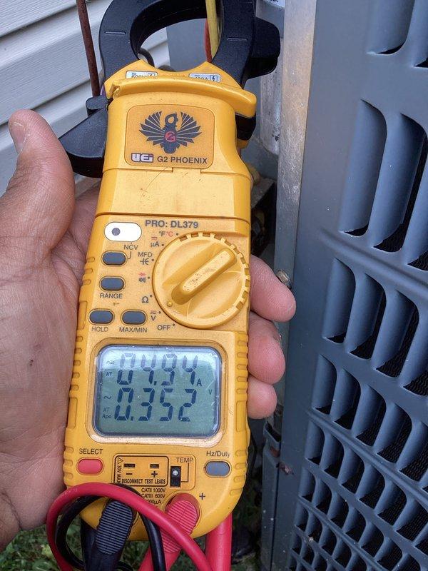 # HVAC Cooling Maintenance Completed

Performed comprehensive preventive maintenance on residential air conditioning system. Conducted thorough inspection of outdoor condensing unit, verifying proper operation of all components. Utilized UEi G2 Phoenix clamp meter to measure electrical parameters including voltage, amperage, and capacitance readings. Recorded system performance data showing 0.94 amps draw and capacitor reading of 2352 microfarads, indicating equipment operating within normal specifications. All measurements confirmed system functioning properly with no deficiencies identified. Unit left in excellent working condition for continued reliable cooling operation.