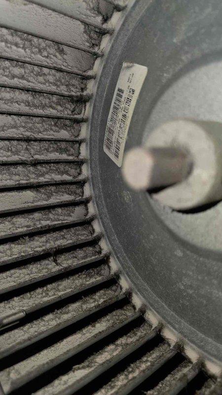 Completed comprehensive cooling system tune-up and inspection. Blower wheel assembly exhibited heavy dust and debris accumulation on blades and housing, reducing airflow efficiency. Evaporator coil area showed significant moisture pooling in drain pan with copper oxidation and corrosion present, along with rust formation on base components and coil fins. System operational parameters verified and unit returned to service.