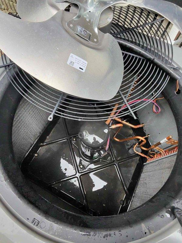 # HVAC Cooling System Maintenance Completed

Performed comprehensive preventive maintenance on an aging residential cooling system over 10 years old. Conducted thorough inspection of outdoor condensing unit, removing top cover to access internal components including compressor, condenser coil, and fan assembly. Verified proper operation of all mechanical and electrical components, inspected copper refrigerant lines for signs of wear or damage, and examined condenser coil fins for debris accumulation. Interior air handler unit was also serviced, with inspection of blower assembly, evaporator coil access, and electrical connections confirmed secure and functioning properly.