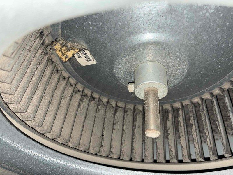 Responded to no cooling complaint on residential air conditioning system. Upon arrival, performed diagnostic evaluation of both AC unit and furnace as requested prior to home sale. Inspected blower assembly and found significant dust and debris accumulation on squirrel cage fan blades and interior housing components. Examined capacitor, motor connections, and electrical wiring for proper operation. Evaluated furnace components including motor assembly, copper refrigerant lines, and mounting hardware. All connections and mechanical components inspected for wear, proper installation, and operational integrity. Documented equipment condition with photographs showing blower wheel contamination and internal component status for service records.