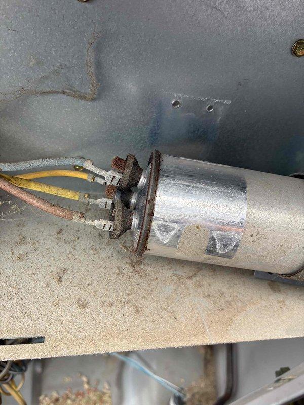 Responded to no cooling complaint on residential air conditioning system. Upon arrival, performed diagnostic evaluation of both AC unit and furnace as requested prior to home sale. Inspected blower assembly and found significant dust and debris accumulation on squirrel cage fan blades and interior housing components. Examined capacitor, motor connections, and electrical wiring for proper operation. Evaluated furnace components including motor assembly, copper refrigerant lines, and mounting hardware. All connections and mechanical components inspected for wear, proper installation, and operational integrity. Documented equipment condition with photographs showing blower wheel contamination and internal component status for service records.