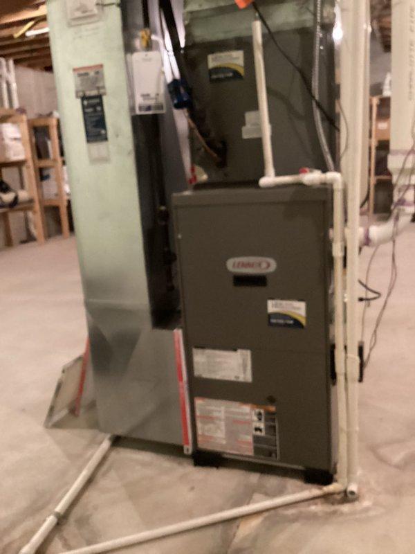 Performed preventive maintenance on two residential HVAC cooling systems. Conducted temperature differential measurements using digital instrumentation, recording readings of 53.04°F at the air handler unit. Inspected both furnace units, ductwork connections, condensate drainage lines, and electrical components for proper operation and seasonal readiness.