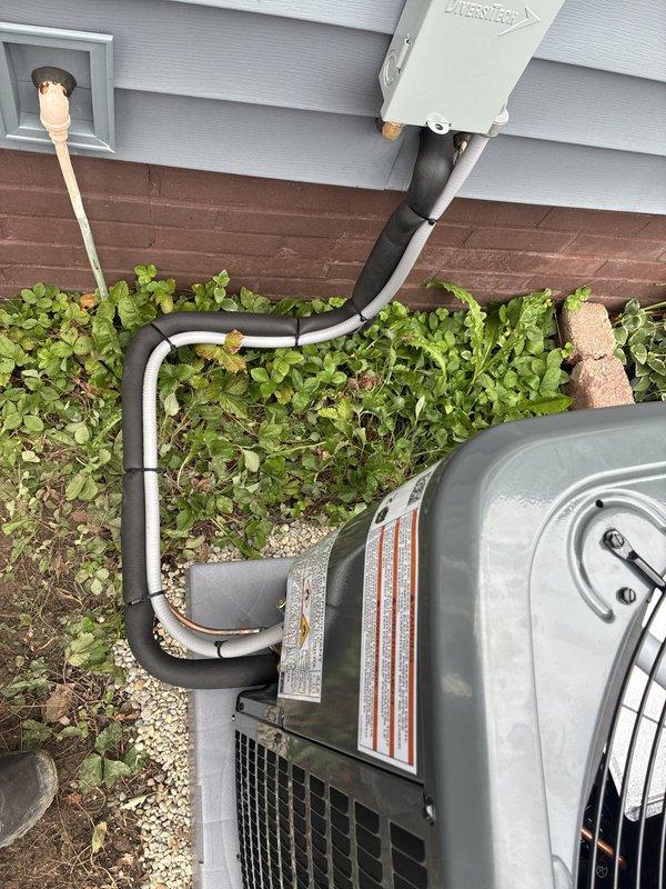 Completed full HVAC system installation including 80% efficiency furnace, air conditioning condenser unit, and whole-home humidifier. New outdoor condenser unit was positioned on concrete pad with proper clearances, refrigerant lines and electrical conduit were run through exterior wall penetration, and all connections were properly sealed and secured. Interior furnace and humidifier components were integrated into existing ductwork system to provide complete climate control solution.