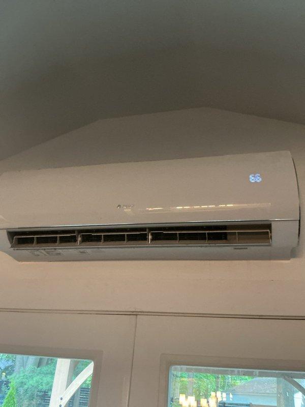 Performed cooling season tune-up on GREE ductless mini-split system. Inspected wall-mounted indoor air handler, verified proper operation of louvers and digital display, and confirmed unit was functioning within normal parameters. System operating properly with no issues found during inspection.