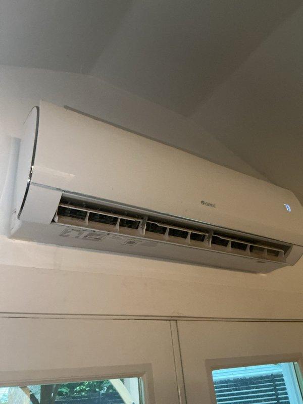Performed cooling season tune-up on GREE ductless mini-split system. Inspected wall-mounted indoor air handler, verified proper operation of louvers and digital display, and confirmed unit was functioning within normal parameters. System operating properly with no issues found during inspection.