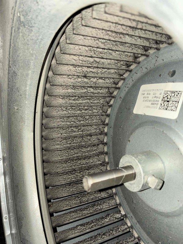 Completed scheduled preventive maintenance on residential air conditioning system. Performed electrical diagnostics on outdoor condenser unit using digital multimeter, recording voltage readings of 59.2 to verify proper power supply and system operation. Inspected blower motor assembly, noting dust and debris accumulation on motor housing and cooling fins that required attention for optimal heat dissipation and equipment longevity. All components assessed for proper function and system confirmed operational.