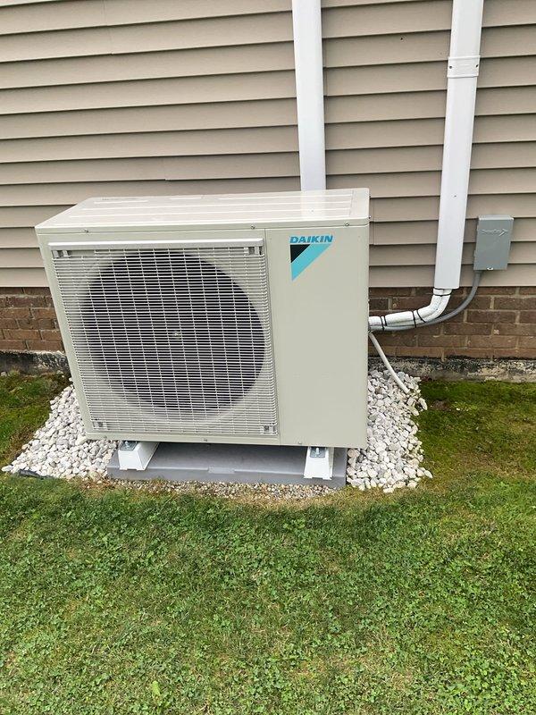 Completed first-year preventive maintenance on Daikin mini-split cooling system. Inspected outdoor condenser unit, verified proper operation of fan assembly, and examined heat exchanger coils which showed minor environmental debris accumulation but remained functional. Confirmed electrical connections, refrigerant lines, and condensate drainage system were secure and operating within normal parameters.